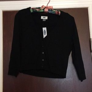 Cropped sleeve, waist length cardigan